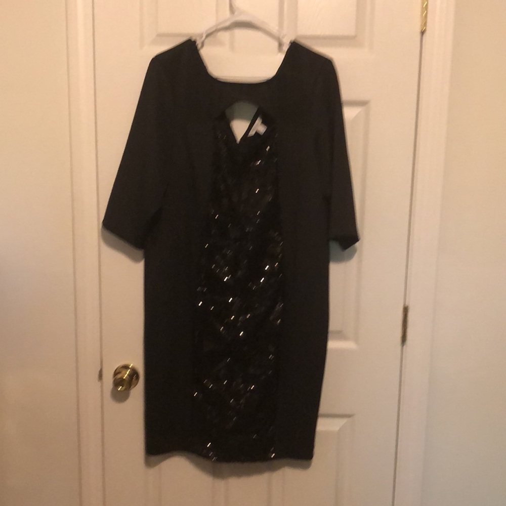 Black dress-sequins down front. Size14-16